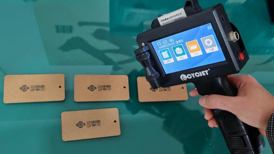 handheld inkjet printer on paper card